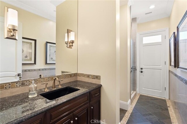 1921 Windward Ln, Newport Beach, CA 92660 - bathroom featuring vanity, baseboards, a stall shower, recessed lighting, and crown molding
