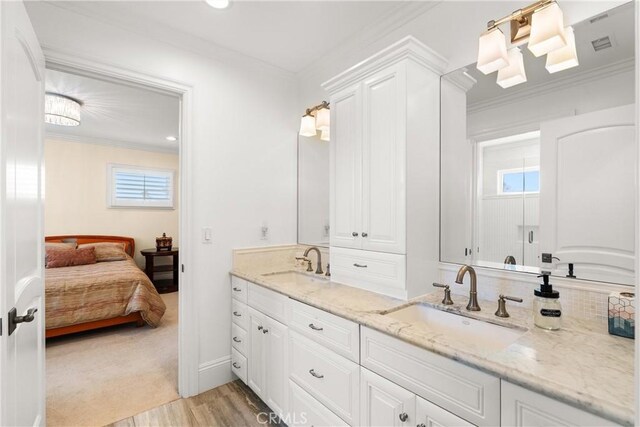 1921 Windward Ln, Newport Beach, CA 92660 - full bath featuring double vanity, connected bathroom, ornamental molding, wood finished floors, and backsplash