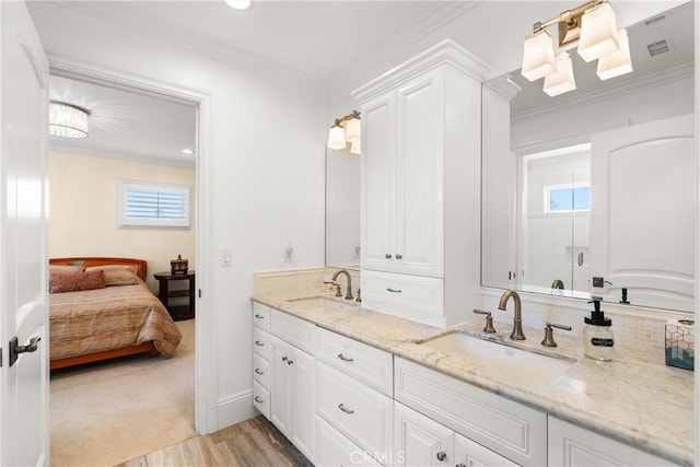 1921 Windward Ln, Newport Beach, CA 92660 - ensuite bathroom featuring double vanity, crown molding, wood finished floors, and decorative backsplash
