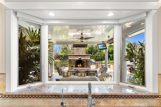 1921 Windward Ln, Newport Beach, CA 92660 - view of patio / terrace featuring an outdoor stone fireplace and ceiling fan