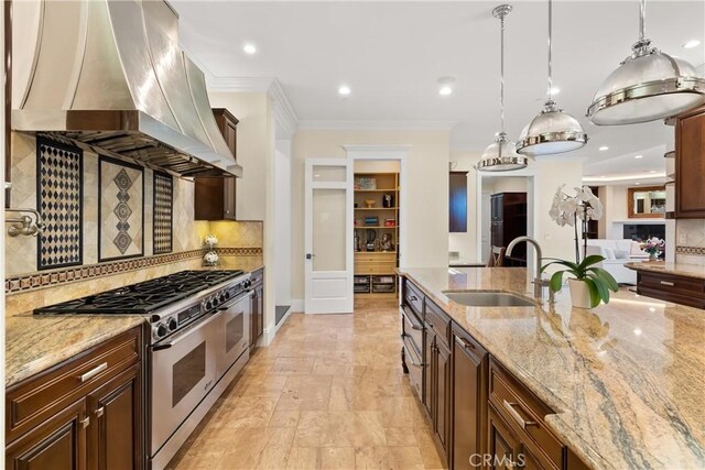 1921 Windward Ln, Newport Beach, CA 92660 - kitchen featuring range with two ovens, island exhaust hood, a sink, tasteful backsplash, and crown molding