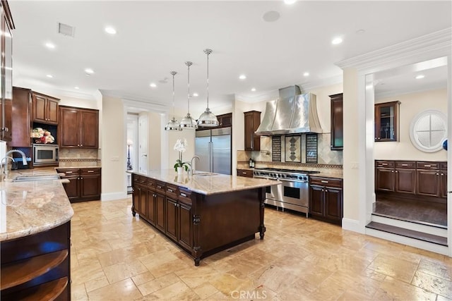 1921 Windward Ln, Newport Beach, CA 92660 - kitchen featuring built in appliances, wall chimney exhaust hood, tasteful backsplash, crown molding, and recessed lighting