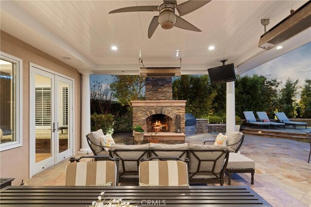 1921 Windward Ln, Newport Beach, CA 92660 - view of patio featuring an outdoor stone fireplace, outdoor dining space, french doors, area for grilling, and a ceiling fan