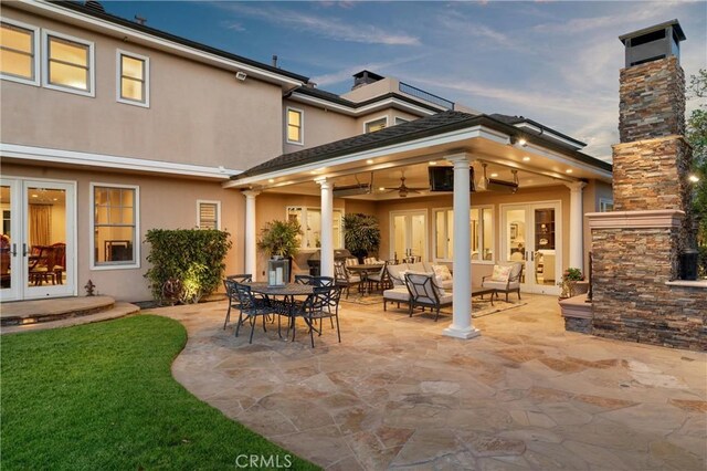 1921 Windward Ln, Newport Beach, CA 92660 - back of house with french doors, stucco siding, a patio area, a chimney, and a ceiling fan