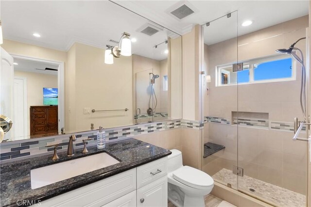 1921 Windward Ln, Newport Beach, CA 92660 - bathroom featuring vanity, a stall shower, toilet, decorative backsplash, and recessed lighting