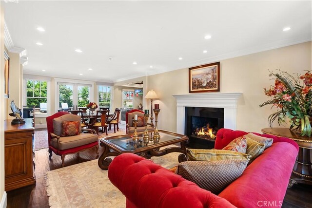 1921 Windward Ln, Newport Beach, CA 92660 - living area featuring crown molding, a lit fireplace, recessed lighting, and wood finished floors