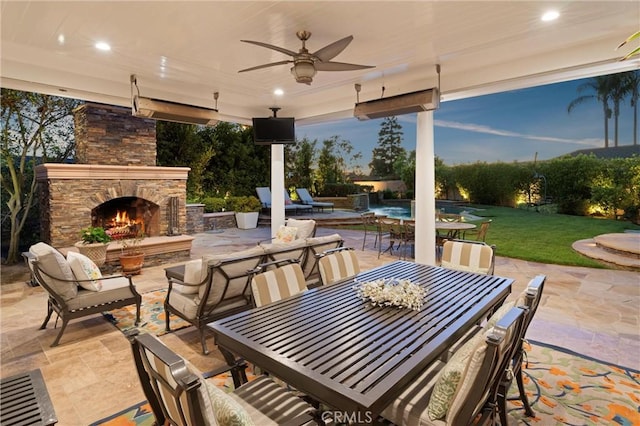 1921 Windward Ln, Newport Beach, CA 92660 - view of patio / terrace featuring an outdoor stone fireplace, outdoor dining area, and ceiling fan