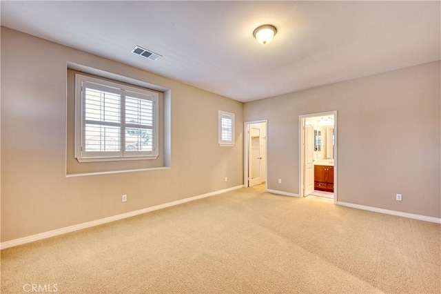 14939 Franklin Ln, Eastvale, CA 92880 - unfurnished bedroom featuring light carpet and ensuite bath