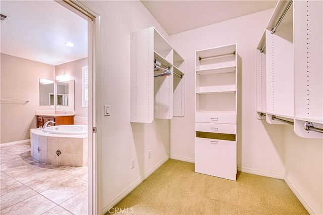 14939 Franklin Ln, Eastvale, CA 92880 - walk in closet featuring a sink and carpet