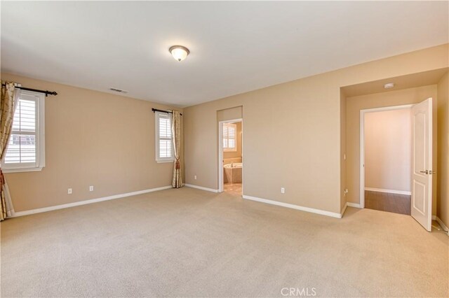 14939 Franklin Ln, Eastvale, CA 92880 - spare room with light colored carpet and baseboards