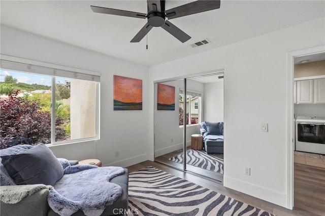19969 Via Joyce Dr, Saugus, CA 91350 - living area featuring wood finished floors, washer / clothes dryer, baseboards, and a ceiling fan