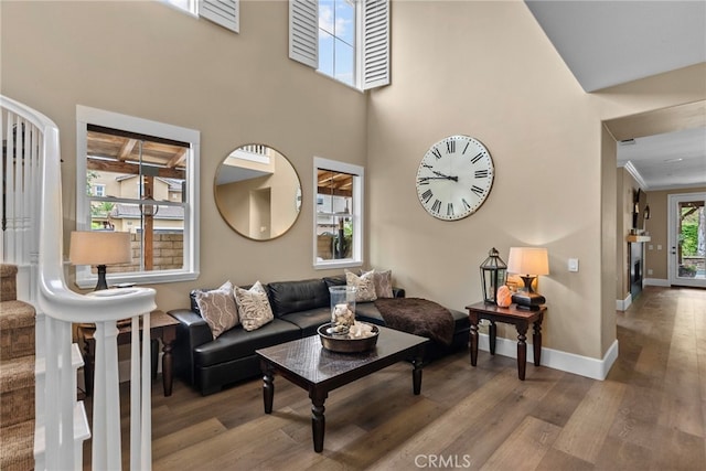 19969 Via Joyce Dr, Saugus, CA 91350 - living area with wood finished floors, baseboards, a towering ceiling, and crown molding