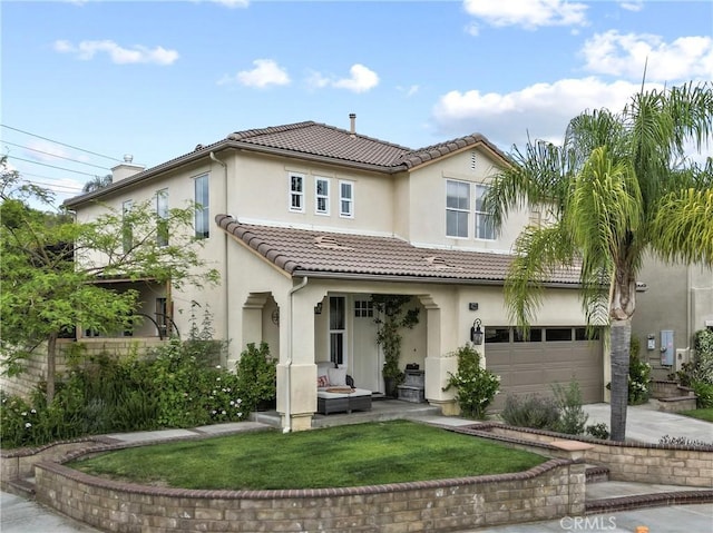 19969 Via Joyce Dr, Saugus, CA 91350 - back of house featuring stucco siding, a tiled roof, driveway, an attached garage, and a lawn