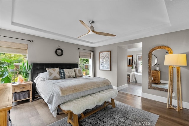 19969 Via Joyce Dr, Saugus, CA 91350 - bedroom featuring a raised ceiling, baseboards, wood finished floors, and a ceiling fan