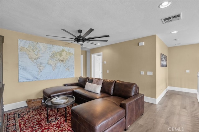 19969 Via Joyce Dr, Saugus, CA 91350 - living room with a ceiling fan, light wood-style flooring, baseboards, recessed lighting, and a textured ceiling