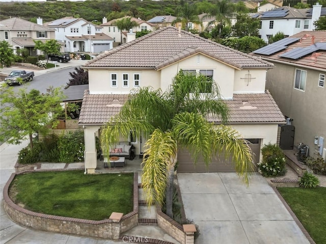 19969 Via Joyce Dr, Saugus, CA 91350 - mediterranean / spanish-style home featuring a residential view, stucco siding, a tiled roof, concrete driveway, and an attached garage