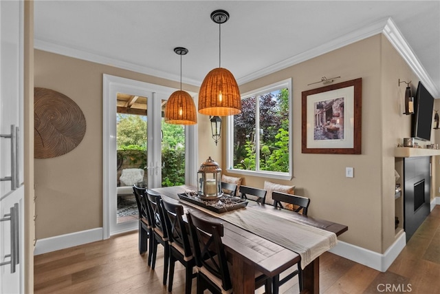 19969 Via Joyce Dr, Saugus, CA 91350 - dining area featuring crown molding, wood finished floors, and baseboards