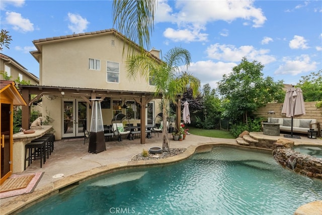19969 Via Joyce Dr, Saugus, CA 91350 - view of swimming pool featuring french doors, an outdoor living space, a patio, and a pool with connected hot tub