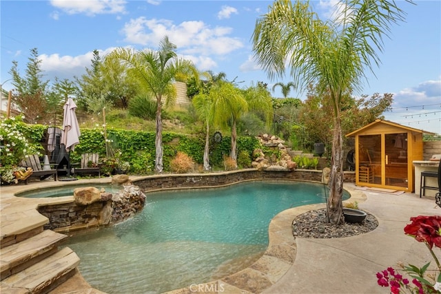 19969 Via Joyce Dr, Saugus, CA 91350 - view of pool with a pool with connected hot tub, a patio area, and an outdoor structure