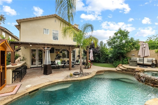 19969 Via Joyce Dr, Saugus, CA 91350 - view of swimming pool featuring french doors, an outdoor living space, a patio, and a pool with connected hot tub