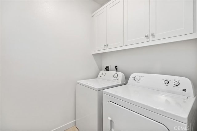 501 Embrook Way, West Covina, CA 91791 - laundry room featuring washing machine and clothes dryer, cabinet space, and baseboards