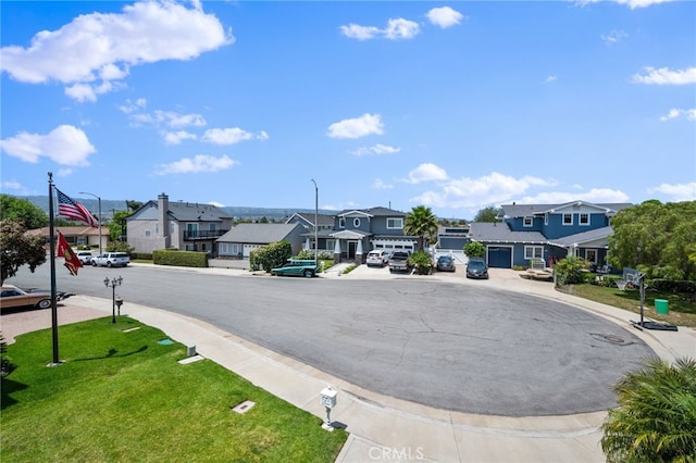 23906 Olson Ln, Lomita, CA 90717 - view of asphalt street with a residential view, street lights, curbs, and sidewalks