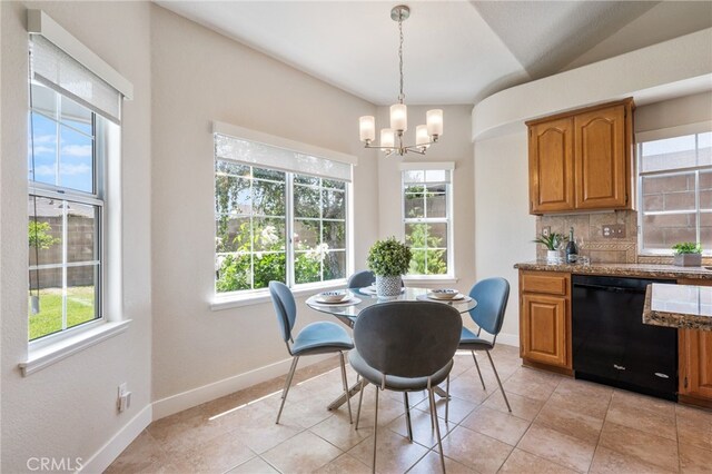 23906 Olson Ln, Lomita, CA 90717 - dining room with a chandelier, light tile patterned floors, and baseboards