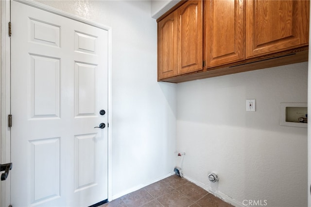 23906 Olson Ln, Lomita, CA 90717 - laundry area with cabinet space, hookup for a washing machine, baseboards, gas dryer hookup, and dark tile patterned flooring