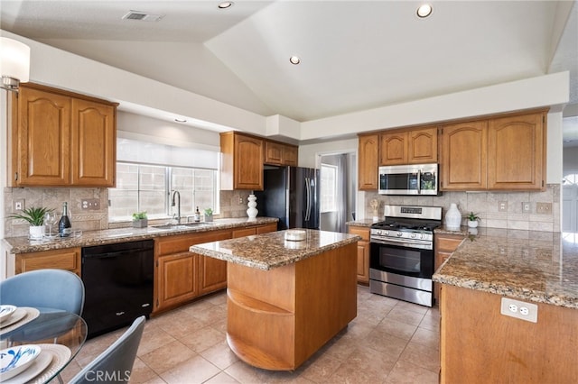 23906 Olson Ln, Lomita, CA 90717 - kitchen featuring black appliances, a sink, lofted ceiling, decorative backsplash, and stone counters