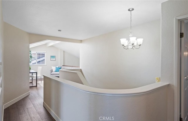 23906 Olson Ln, Lomita, CA 90717 - corridor with wood finished floors, a chandelier, lofted ceiling, and baseboards