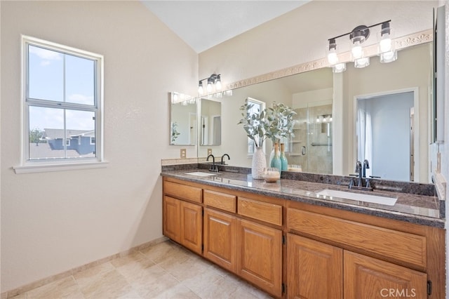 23906 Olson Ln, Lomita, CA 90717 - full bath with double vanity, a stall shower, vaulted ceiling, baseboards, and tile patterned flooring