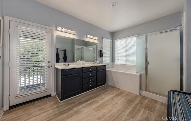 29207 Clear Spring Ln, Highland, CA 92346 - full bath with a garden tub, double vanity, wood finished floors, and a stall shower