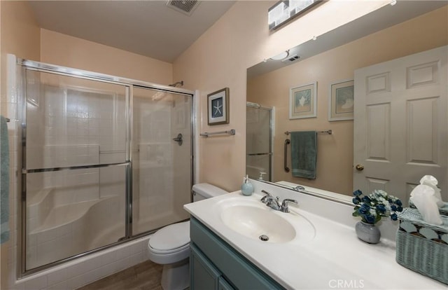 29207 Clear Spring Ln, Highland, CA 92346 - bathroom featuring toilet, a shower stall, vanity, and wood finished floors