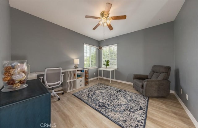 29207 Clear Spring Ln, Highland, CA 92346 - home office with light wood-style floors, a ceiling fan, and baseboards