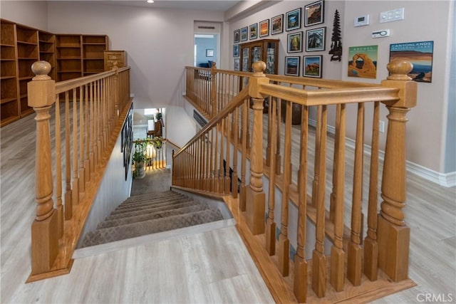 29207 Clear Spring Ln, Highland, CA 92346 - staircase with wood finished floors, baseboards, and recessed lighting