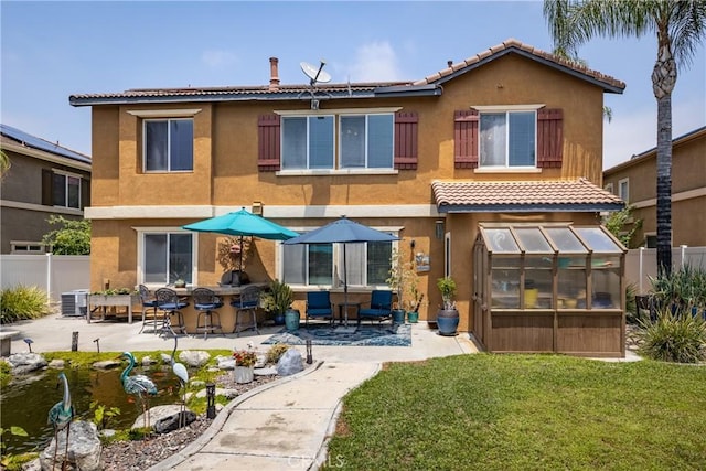 29207 Clear Spring Ln, Highland, CA 92346 - back of property with a tiled roof, an exterior structure, stucco siding, and a patio