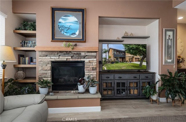 29207 Clear Spring Ln, Highland, CA 92346 - living room featuring wood finished floors, baseboards, and a fireplace