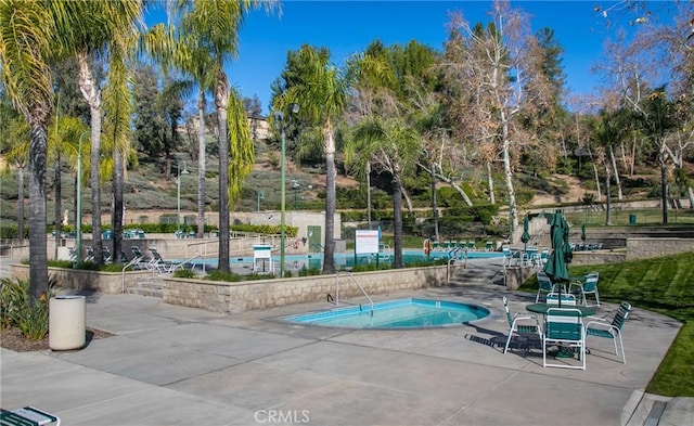 29207 Clear Spring Ln, Highland, CA 92346 - view of swimming pool featuring a patio area, a swimming pool, and view of wooded area