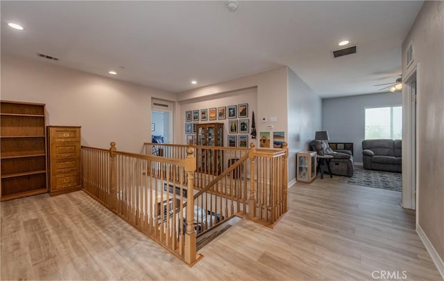 29207 Clear Spring Ln, Highland, CA 92346 - corridor with an upstairs landing, light wood-type flooring, recessed lighting, and baseboards