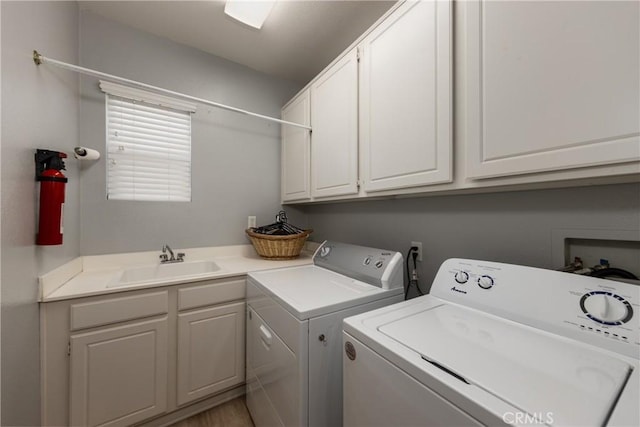 29207 Clear Spring Ln, Highland, CA 92346 - washroom featuring washer and dryer and cabinet space