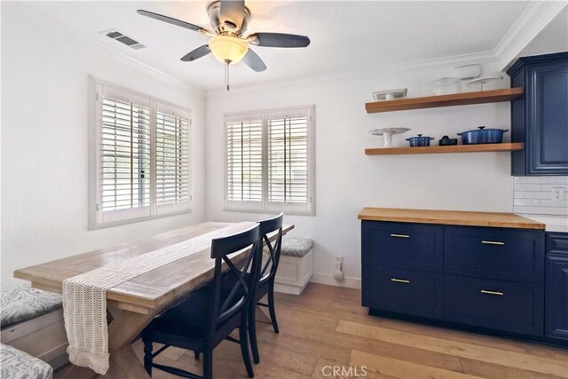2013 Speyer Ln Unit A, Redondo Beach, CA 90278 - dining area with light wood-style flooring, a ceiling fan, crown molding, and baseboards