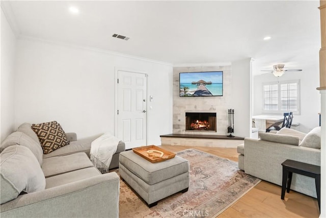 2013 Speyer Ln Unit A, Redondo Beach, CA 90278 - living room with a large fireplace, light wood-style floors, ornamental molding, recessed lighting, and a ceiling fan