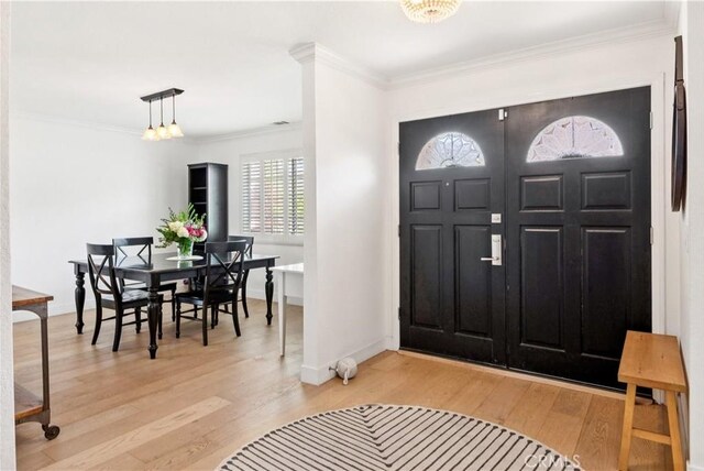 2013 Speyer Ln Unit A, Redondo Beach, CA 90278 - entrance foyer with light wood-style flooring, ornamental molding, and baseboards