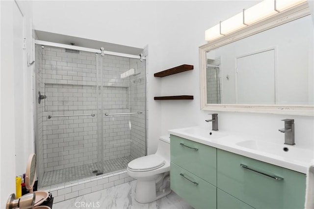 1675 W Lambert Rd Unit G, La Habra, CA 90631 - bathroom featuring double vanity, marble finish floors, a shower stall, and toilet