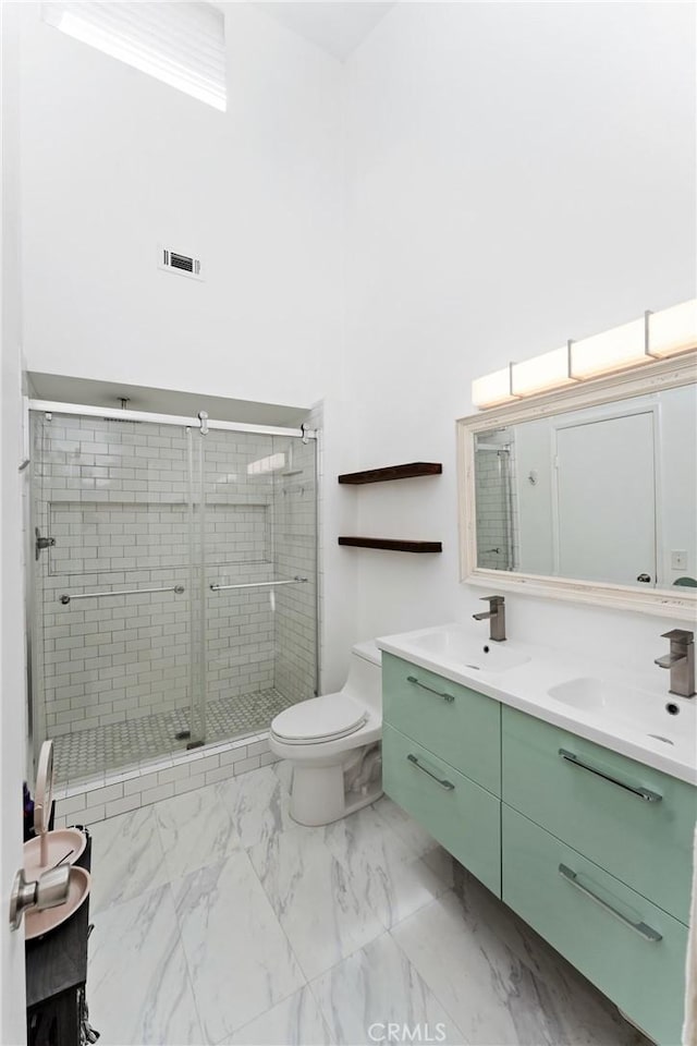 1675 W Lambert Rd Unit G, La Habra, CA 90631 - full bath with double vanity, a shower stall, toilet, and marble finish floors