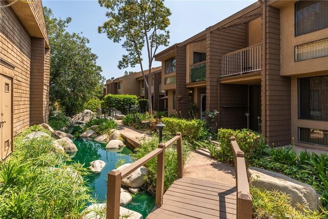 1675 W Lambert Rd Unit G, La Habra, CA 90631 - view of property's community featuring a small pond