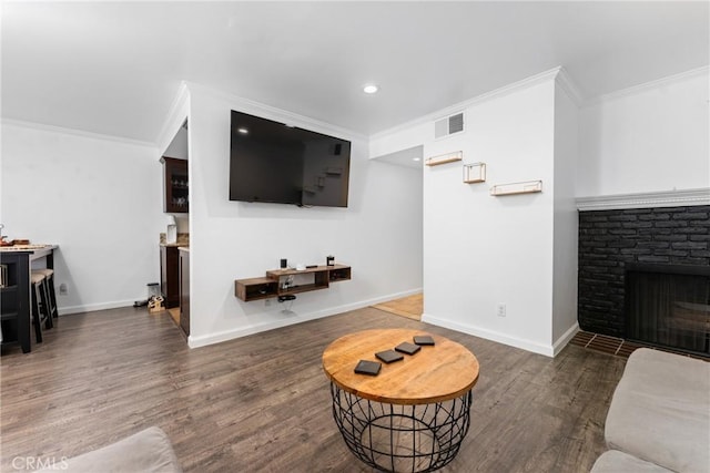 1675 W Lambert Rd Unit G, La Habra, CA 90631 - living area featuring crown molding, baseboards, wood finished floors, a brick fireplace, and recessed lighting