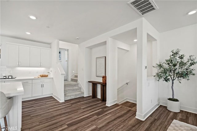 297 Lynx, Irvine, CA 92618 - kitchen featuring dark wood-style flooring, light countertops, white cabinets, tasteful backsplash, and recessed lighting