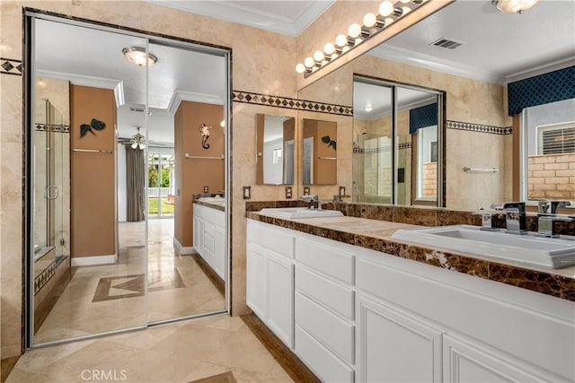 960 Hemingway Dr, Corona, CA 92878 - bathroom featuring ornamental molding, double vanity, a shower stall, ceiling fan, and marble finish flooring
