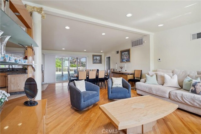 1606 Glenmont Dr, Glendale, CA 91207 - living area featuring light wood finished floors, vaulted ceiling, and recessed lighting